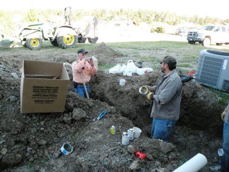 Discussing the intracacies of sewer installation